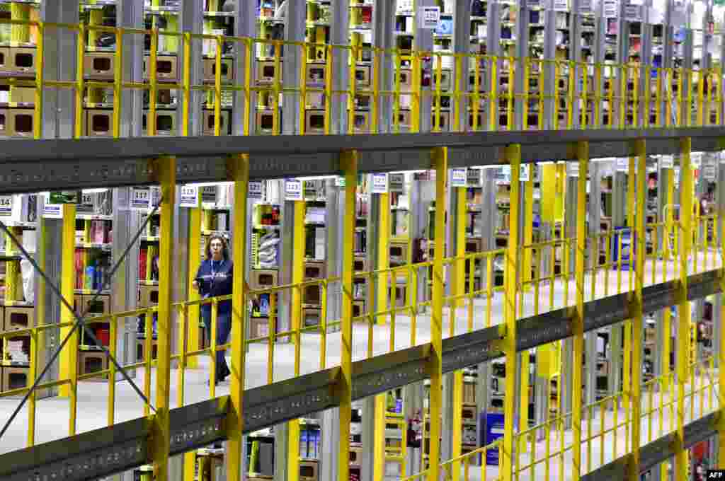 An employee works at the Amazon electronic commerce company's logistics center in San Fernando de Henares, near Madrid, Spain, on the eve of "Black Friday."