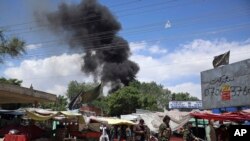 FILE - Smokes rises from a maternity hospital, after gunmen attacked in Kabul, Afghanistan, May 12, 2020. 