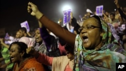 Sudanese anti-government protesters chant slogans during a demonstration in Khartoum, Sudan, Sunday, Sept. 29, 2013. 