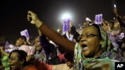 Sudanese anti-government protesters chant slogans during a demonstration in Khartoum, Sudan, Sunday, Sept. 29, 2013. Thousands of Sudanese protesters took to the streets in night march in the capital Khartoum late Sunday. (AP Photo/Khalil Hamra)