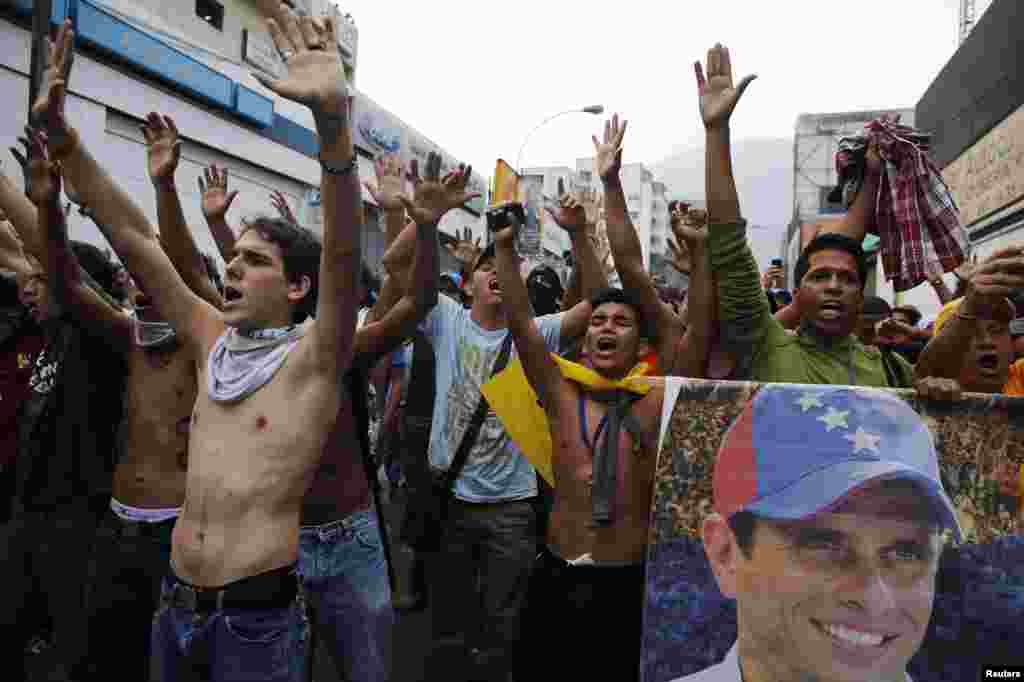Supporters of opposition leader Henrique Capriles block a street while demonstrating for a recount of the votes in Sunday's election.