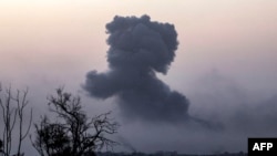 This picture taken from southern Israel near the border with the Gaza Strip shows smoke billowing after an Israeli strike on north Gaza on November 23, 2023, amid ongoing battles between Israel and the Palestinian Hamas movement. (Photo by Menahem KAHANA 
