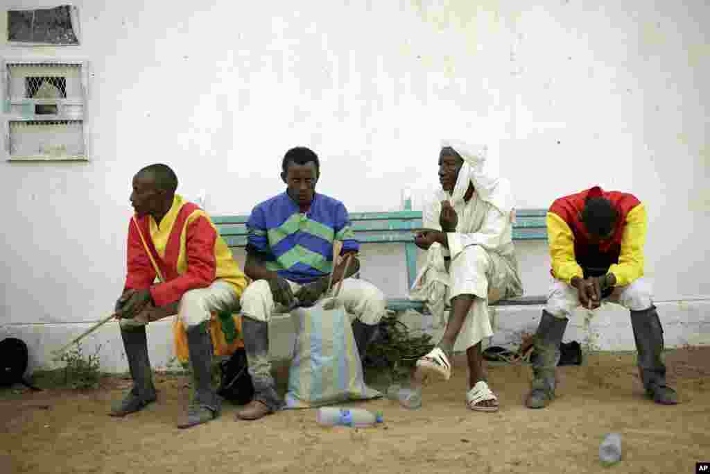 Chadian jockeys wait for a race at the hippodrome in N'djamena, Chad, March 15, 2015.