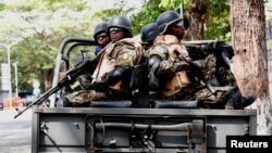 Presidential security force members keep guard near the Ivorian parliament in Abidjan, Ivory Coast, Jan. 10, 2017. 