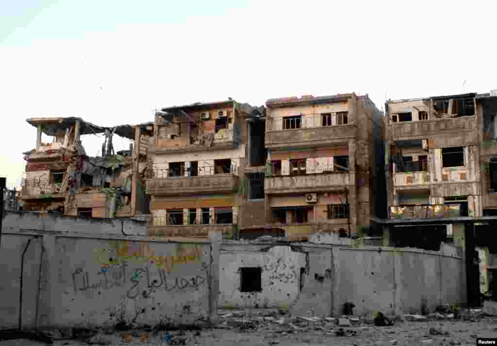 A view shows damaged buildings and debris in the Khaldiyeh district of Homs, May 9, 2013.