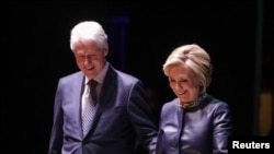 FILE - Former Secretary of State Hillary Clinton and former President Bill Clinton appear together at an event at Beacon Theatre in New York, April 11, 2019.