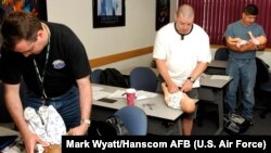 Dads who help around the house increase the happiness in their homes. These dads at Hanscom AFB in Massachusetts are taking a class called Dads 101.