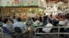 FILE - A group of Vietnamese Americans eat lunch at the Asian Garden mall in the Little Saigon section of Westminster, California.