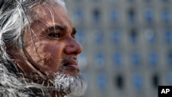Ravi Ragbir, executive director of the New Sanctuary Coalition, arrives for his annual check-in with Immigration and Customs Enforcement, March 9, 2017, in New York. The Trinidadian immigrant works with an interfaith network of congregations and activists seeking to protect New York's immigrant families from detention and deportation. He was convicted of wire fraud in 2001 and served his sentence but fears he will now be deported.