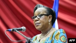 FILE - Transitional president of the Central African Republic, Catherine Samba Panza, gives a speech in Bangui before members of the Conseil National de Transition, the transitional parliament, May 6, 2014. Samba Panza pleads with the international community to help develop the war-ravaged country. 
