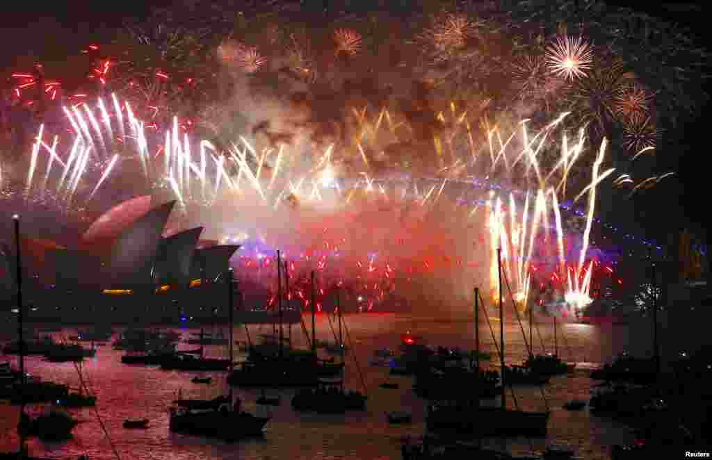 Fireworks light up the Sydney Harbour Bridge and Sydney Opera House during New Year's celebrations on Sydney Harbour, Australia, Jan. 1, 2018.
