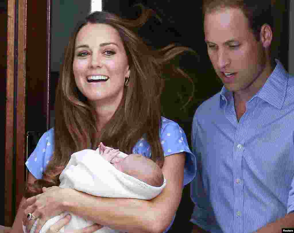 Britain's Prince William and his wife Catherine, Duchess of Cambridge, appear with their baby son outside the Lindo Wing of St Mary's Hospital in central London.