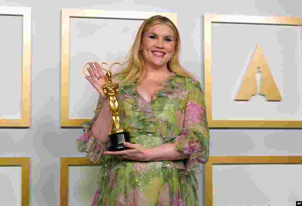 Emerald Fennell, winner of the award for best original screenplay for "Promising Young Woman," poses in the press room at the Oscars on Sunday, April 25, 2021, at Union Station in Los Angeles. (AP Photo/Chris Pizzello, Pool)