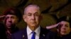 FILE - Israeli Prime Minister Benjamin Netanyahu attends a wreath-laying ceremony in Jerusalem, May 6, 2024. U.S. President Joe Biden said in a newly released interview there is “every reason” to believe Netanyahu is dragging out the Gaza war to save himself politically.
