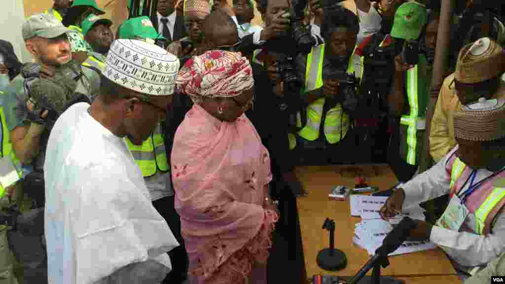 General Muhammadu Buhari, the Pesidential candidate of the opposite APC and his wife, Aishatu Buhari, been accredited at their polling unit, Kofar Faru III in Daura, Katsina state.