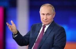 FILE - Russian President Vladimir Putin speaks during an annual nationwide televised phone-in show in Moscow, Russia, June 30, 2021.