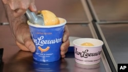 Ben Van Leeuwen scoops Kraft Mac & Cheese flavored ice cream Wednesday, May 15, 2024, in the Brooklyn borough of New York. (AP Photo/Frank Franklin II)