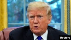 U.S. President Donald Trump sits for an exclusive interview with Reuters journalists in the Oval Office at the White House in Washington, Dec. 11, 2018. 