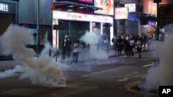 Tear gas engulf the streets of Hong Kong, Oct. 27, 2019. 