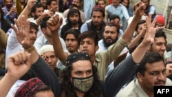 FILE - Activists of Pashtun Protection Movement (PTM) protest against the arrest of their activists and leaders, in Karachi on Feb. 10, 2019. 