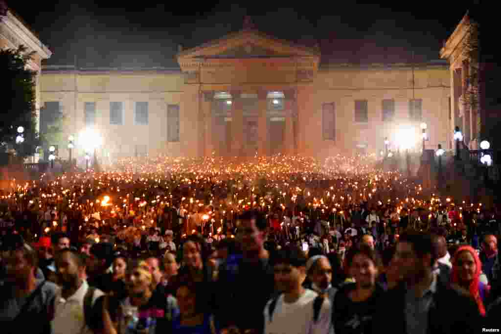People attend the March of Torches, which is held annually in celebration of the birth anniversary of Cuba's independence hero Jose Marti, in Havana, Jan. 27, 2025.
