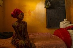 A woman sits on her bed in a classroom turned into a IDP camp in central Mekelle, the capital of the Tigray region, June 4, 2021. Like her, 200,000 people are displaced after fleeing the battles in Tigray. (Yan Boechat/VOA)