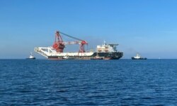 FILE - The Russian pipe-laying vessel Fortuna, which may be used to complete the construction of the Nord Stream 2 Baltic Sea gas pipeline, makes its way to Wismar, Germany, Sept. 30, 2020.