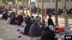 Afghan internally displaced families, who fled due to the ongoing battle between Taliban fighters and Afghan security forces, at a refugee camp in Kandahar on July 27, 2021. 
