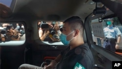FILE - Tong Ying-kit arrives at a court on July 6, 2020, for the violation of the new security law after carrying a flag reading "Liberate Hong Kong, Revolution of our times" during a protest in Hong Kong.