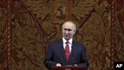 Russian President Vladimir Putin delivers his speech at a gala on the occasion of the New Year at the Bolshoi Theater in Moscow, Russia, Dec. 26, 2019. 