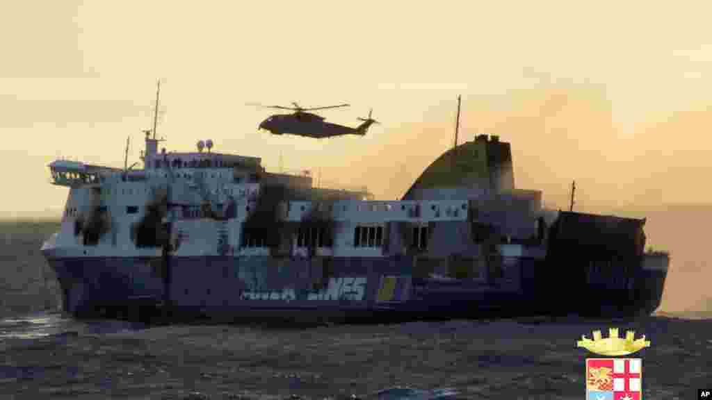 In this image released by the Italian Navy, smoke billows from the Italian-flagged Norman Atlantic that caught fire in the Adriatic Sea, Dec. 29, 2014.