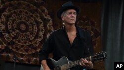 FILE - Rodney Crowell performs at Magnolia Fest at the Spirit of Suwannee Music Park in Live Oak, Florida, Oct. 18, 2014.