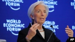FILE - Christine Lagarde, Managing Director of the IMF, attends a session on the Economic Outlook on the fourth day of the annual meeting of the World Economic Forum in Davos, Switzerland, Jan. 20, 2017.