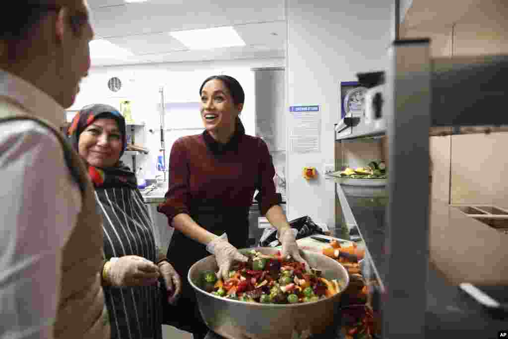 Meghan, Duchess of Sussex visits the Hubb Community Kitchen to see how funds raised by the 'Together: Our Community' Cookbook are making a difference at Al Manaar, North Kensington in London.