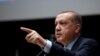 ប្រធានាធិបតី​ Erdogan ឈរមើល​ក្រុមអង្គរក្ស​វាយតប់​ក្រុម​បាតុករ
