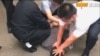 香港记者北京采访时被拘 香港民主党谴责