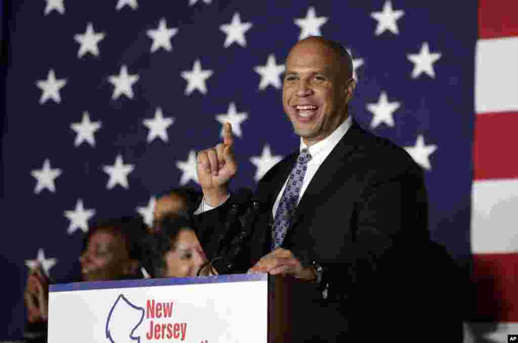 In New Jersey, Democrat Cory Booker is re-elected to the Senate and celebrates at a gathering in Newark on Nov. 4, 2014.