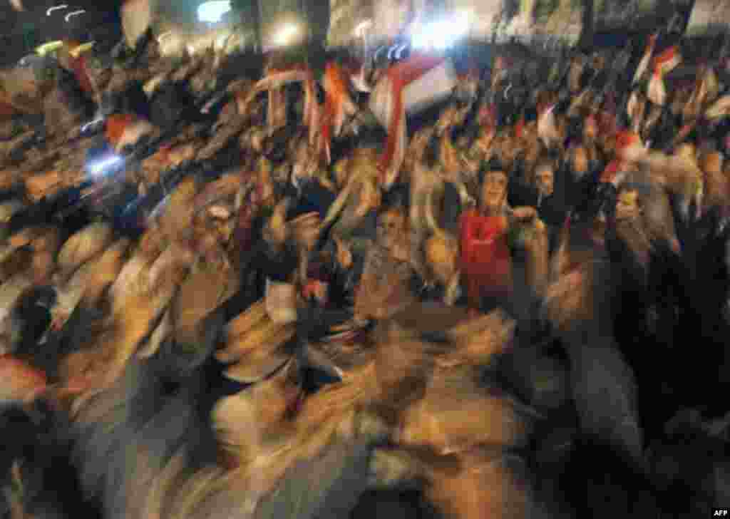 Egyptian citizens celebrate after President Hosni Mubarak resigned and handed power to the military at Tahrir square, in Cairo, Egypt, Friday, Feb. 11, 2011. Egypt exploded with joy, tears, and relief after pro-democracy protesters brought down President
