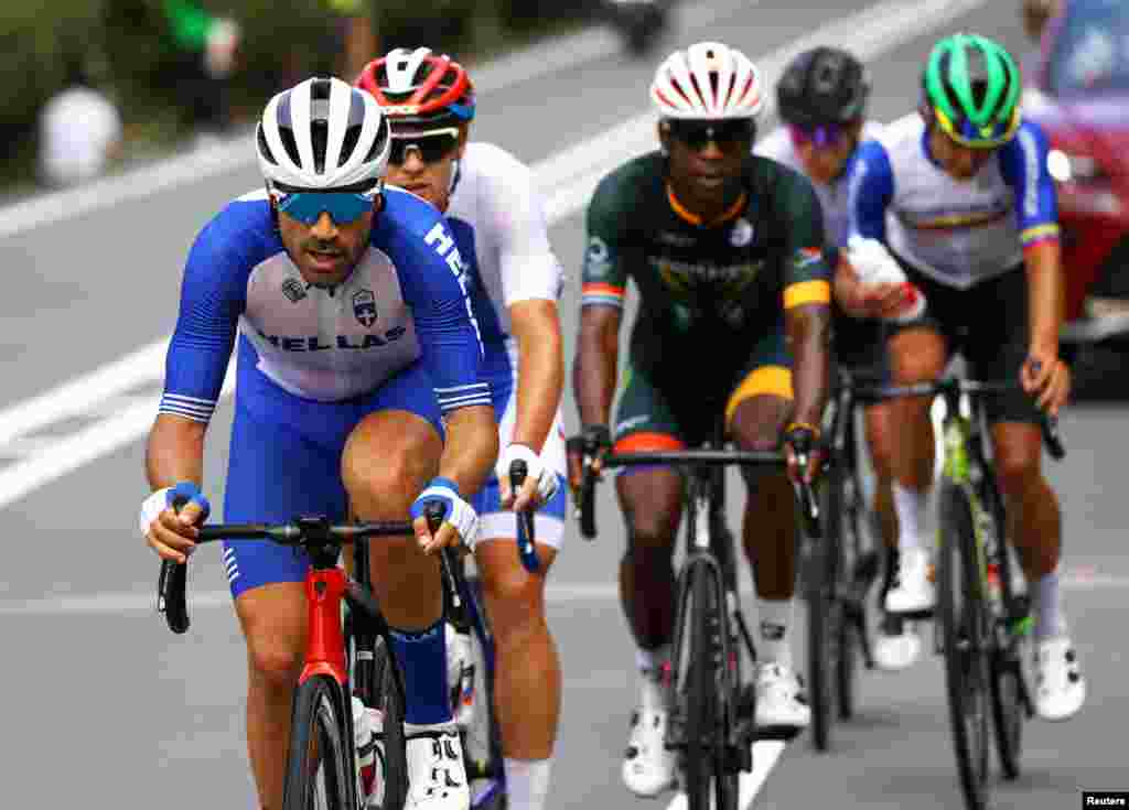 Polychronis Tzortzakis of Greece, Michael Kukrle of Czech Republic, Nicholas Dlamini of South Africa and Orluis Aular of Venezuela in action during the Men's Road Race. Pool via Reuters/Tim de Waele