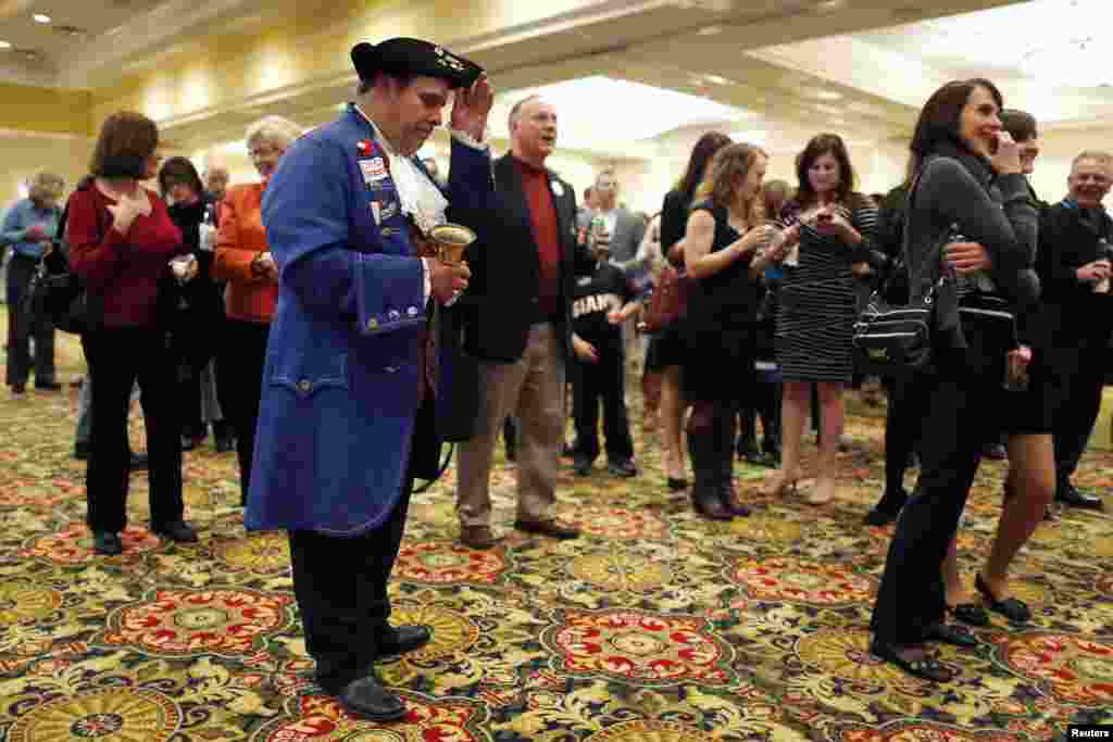Thomas Paine re-enactor John Wallmeyer, a member of four different Tea Party organizations, waits with fellow Republican supporters for poll numbers and election results, Richmond, Virginia, Nov. 5, 2013.