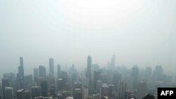 Chicago's skyline is seen from the 360 Chicago Observation Deck of the John Hancock Building with heavy smoke from the Canadian wildfires blanketing the city, on June 27, 2023, in Chicago, Illinois.