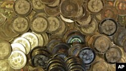 FILE - Bitcoins.