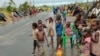 Survivors of Cyclone Idai in a makeshift shelter by the roadside near Nhamatanda about 50 kilometres from Beira, in Mozambique, March, 22, 2019.