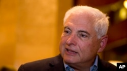FILE - Panama's former President Ricardo Martinelli answers questions during an interview at a hotel in Guatemala City.