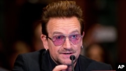 FILE - Irish rock star and activist Bono testifies on Capitol Hill in Washington before a Senate subcommittee hearing on the causes and consequences of violent extremism and the role of foreign assistance, April 12, 2016. 