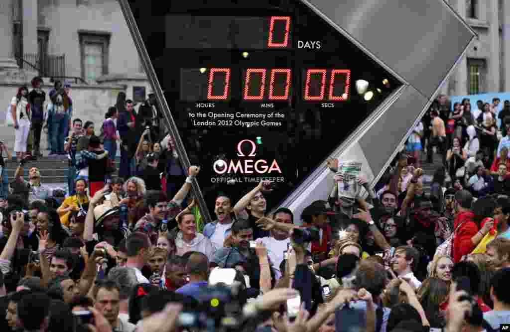 People photograph the countdown clock at Trafalgar Square in downtown London prior to the Opening Ceremony of the 2012 Summer Olympics, July 27, 2012, in London.