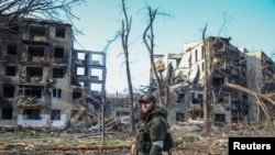 A service member from Chechen Republic looks on during fighting in Ukraine-Russia conflict in Mariupol