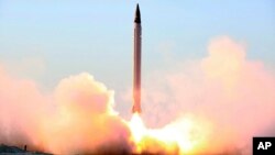 This photo released by the official website of the Iranian Defense Ministry on Sunday, Oct. 11, 2015, claims to show the launching of an Emad long-range ballistic surface-to-surface missile in an undisclosed location.