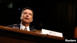 FILE - Former FBI Director James Comey testifies before a Senate Intelligence Committee hearing on Russia's alleged interference in the 2016 U.S. presidential election on Capitol Hill in Washington, June 8, 2017.
