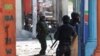 Haiti's prime minister orders gangs to drop weapons and promises to take back control of the capital